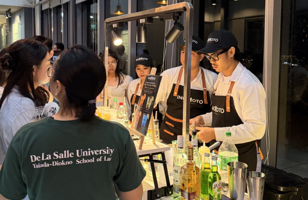 Inomoto Mobile Bar staff serving cocktails at DLSU Law's Rufino Campus in BGC for a 2026 bar exam celebration
